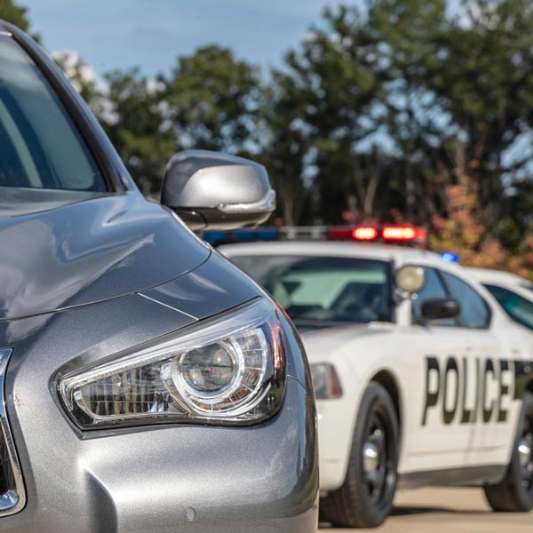 Police car behind another vehicle